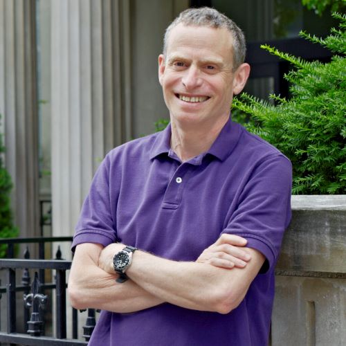 Arthur Ripstein standing outside in front of UofT building